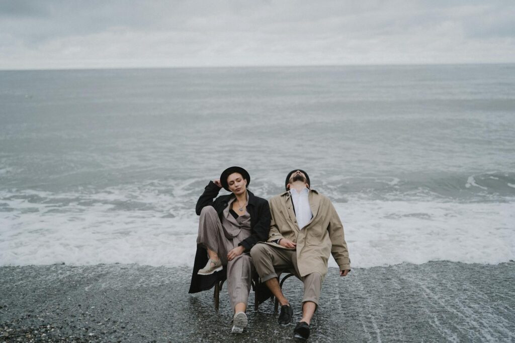 A Man and a Woman Sitting on a Shore